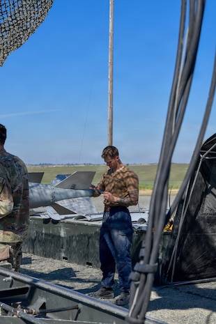 Airmen, Marines and Sailors prepared live munitions to support 24-hour sortie requirements while strengthening mission-critical skills. With its first class held in 1986, AFCOMAC celebrated its 40th anniversary with the graduation of class 2026-004. (U.S. Air Force photo by 1st Lt. Sharon Kinghorn)