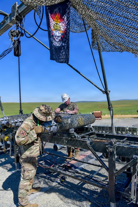 Airmen and Marines prepared live munitions to support 24-hour sortie requirements while strengthening mission-critical skills. With its first class held in 1986, AFCOMAC celebrated its 40th anniversary with the graduation of class 2026-004. (U.S. Air Force photo by 1st Lt. Sharon Kinghorn)