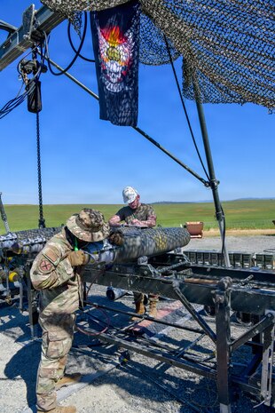 Airmen and Marines prepared live munitions to support 24-hour sortie requirements while strengthening mission-critical skills. With its first class held in 1986, AFCOMAC celebrated its 40th anniversary with the graduation of class 2026-004. (U.S. Air Force photo by 1st Lt. Sharon Kinghorn)