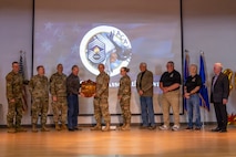 Hosted by the 9th MUNS, AFCOMAC provides advanced training in mass combat ammunition planning and production, preparing personnel to establish bomb dumps and build thousands of live munitions in realistic, bare-base scenarios through its Combat Ammunition and Production (CAPP) course and Senior Leader Aerial Munitions Course (SLAM-C). AFCOMAC class 2026-004 consisted of a joint force featuring Airmen, Sailors and Marines and broke the AFCOMAC record for the highest amount of munitions built, 915, along with the fewest discrepancies. The first class was held in 1986 at Sierra Army Depot, California, devised and led by the first cadre.  (U.S. Air Force photo by Senior Airman Frederick A. Brown)