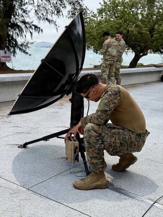 U.S. Marine Corps Sgt. Lucas Williams, 2nd Joint Communications Squadron, Joint Communications Support Element, tests Hawkeye IV X-band Military Satellite Communications at Hat Yao Beach in Rayong province, Thailand, Feb. 25, 2026, in support of the Exercise Cobra Gold 2026 Combined Joint Forces Maritime Component.
