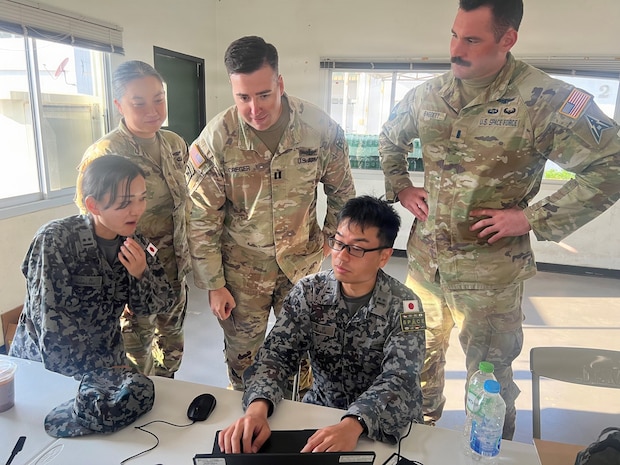 1st Lt. Komatsu Haruko and 1st Lt. Harada Ryotaro, both with Japan Air Self Defense Force, and U.S. Army Maj. Stacy Kang, U.S. Army Capt. Russell Creger, and U.S. Space Force 1st Lt. Jimmy Bagget, integrate space capabilities during Exercise Cobra Gold 2026 from the Combined Space Force Coordination Center, Rayong Province, Thailand, March 3, 2026.