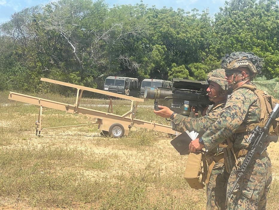 U.S. Marine Corps Cpl. Dominic Matica receives instruction from Lance Cpl. Graham Gleaton, both with 1st Low Altitude Air Defense Battalion, Marine Air Control Group 18, 1st Marine Aircraft Wing, on tracking an MQM-170 Outlaw drone with a FIM-92 Stinger at the Exercise Cobra Gold 2026
