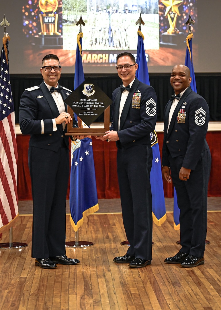 Airman accepting award