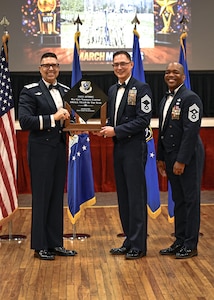 Airman accepting award