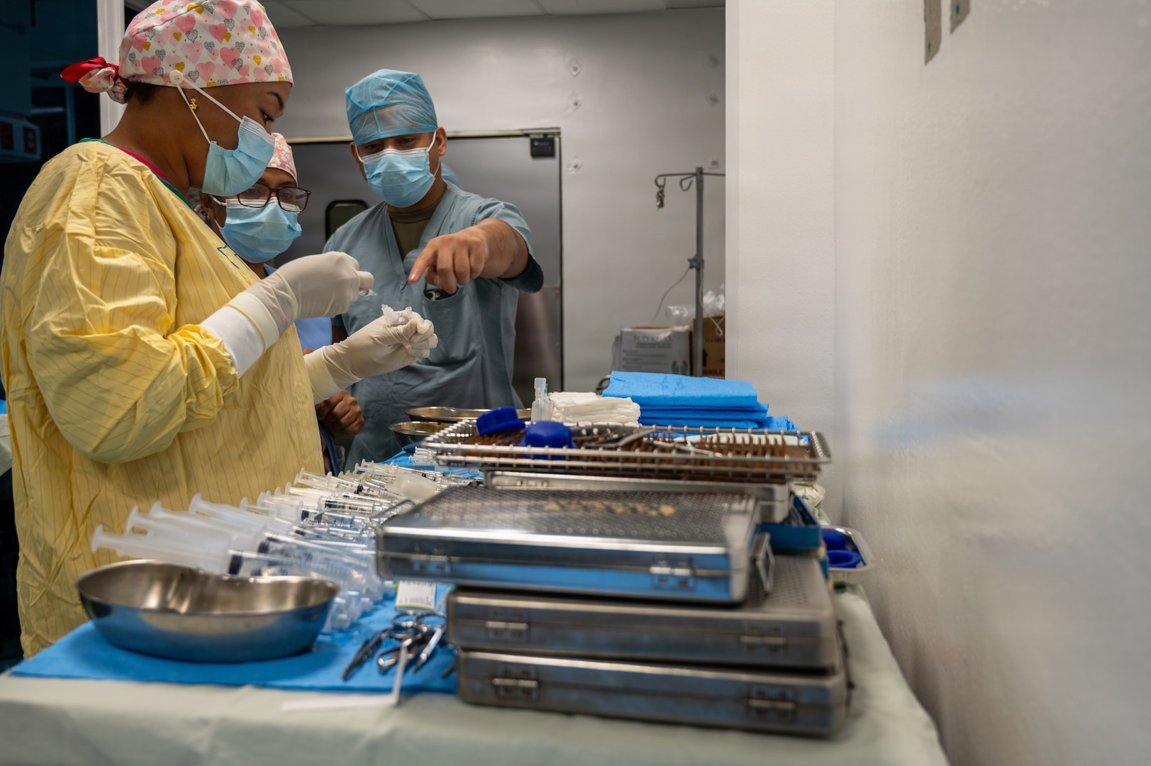 U.S. Air Force Tech. Sgt. Clark Galvez, 59th Medical Wing ophthalmic technician, right, points out medical instruments to Guyanese surgical technicians at the Georgetown Public Hospital Corporation in Georgetown, Guyana, March 18, 2026. The Guyana Ministry of Health identified priority specialties based on national needs, enabling U.S. Air Force ophthalmology teams to sharpen clinical readiness while working alongside local providers to strengthen lasting partnerships. (U.S. Air Force Photo by Maj. Stephani Schafer)