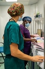 U.S. Air Force Lt. Col. Jessica Bolton, 96th Medical Group ophthalmologist, front, and Dr. Celeste Hines, Guyanese ophthalmologist, review patient records prior to beginning ophthalmological procedures at the Georgetown Public Hospital Corporation in Georgetown, Guyana, March 18, 2026. During the Lesser Antilles Medical Assistance Team (LAMAT) 2026 mission, U.S. Air Force ophthalmology teams performed critical eye procedures alongside Ministry of Health providers, enhancing surgical readiness while improving vision outcomes and strengthening enduring partnerships. (U.S. Air Force photo by Maj. Stephani Schafer)