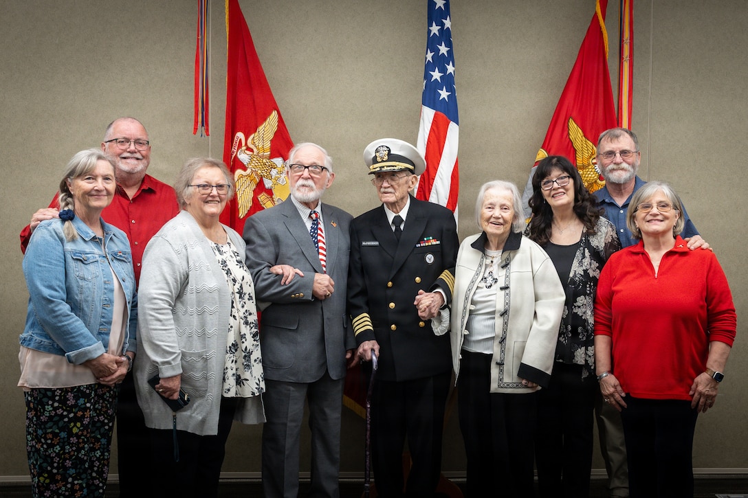 Family of the late Maj. Everette McPherson, pose for a picture before a posthumous Distinguished Flying Cross ceremony at Marine Support Facility New Orleans, March 18, 2026. The Distinguished Flying Cross is awarded to those who have displayed single acts of heroism or extraordinary achievement while participating in aerial flight. Maj. McPherson, a fighter jet pilot, posthumously received the award for sacrificing his life during the Vietnam War in an attempt to save the life of his co-pilot. (U.S. Marine Corps photo by Lance Cpl. Claire Cheney)