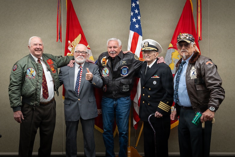 Brothers of Maj. Everette McPherson and Marines who served alongside him pose for a photo before a posthumous Distinguished Flying Cross ceremony at Marine Support Facility New Orleans, March 18, 2026. The Distinguished Flying Cross is awarded to those who have displayed single acts of heroism or extraordinary achievement while participating in aerial flight. Maj. McPherson, a fighter jet pilot, posthumously received the award for sacrificing his life during the Vietnam War in an attempt to save the life of his co-pilot. (U.S. Marine Corps photo by Lance Cpl. Claire Cheney)