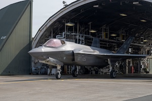 A U.S. Air Force F-35A Lightning II assigned to the 13th Fighter Squadron taxis out of a hangar during the F-35 first aircraft arrival at Misawa Air Base, Japan, March 28, 2026.