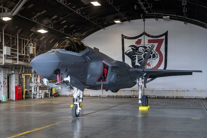 A U.S. Air Force F-35A Lightning II assigned to the 13th Fighter Squadron (FS) sits in a hangar with the 13th FS logo during the F-35 first aircraft arrival at Misawa Air Base, Japan, March 28, 2026.