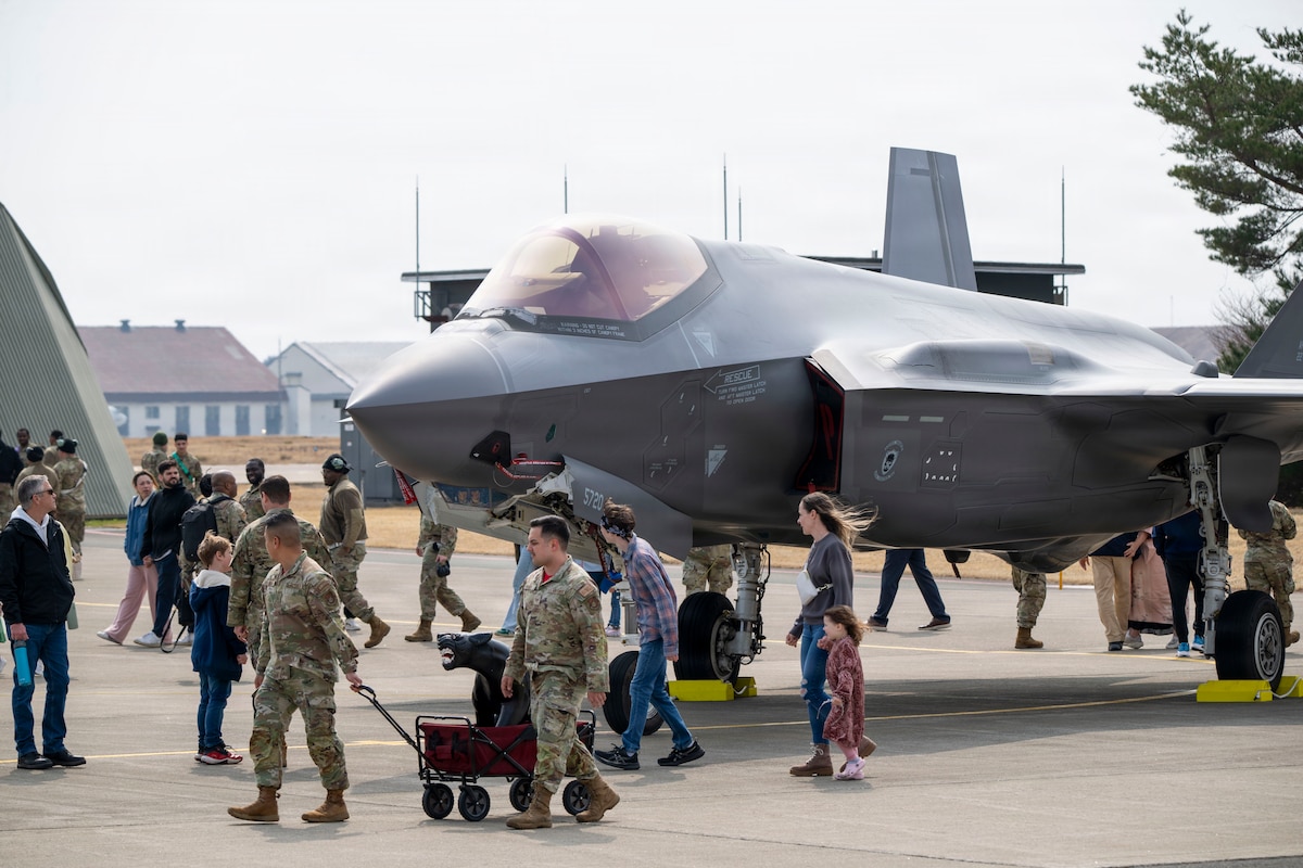 Service members, families and community members walk past a parked U.S. Air Force F-35A Lightning II during the F-35 first aircraft arrival at Misawa Air Base, Japan, March 28, 2026.