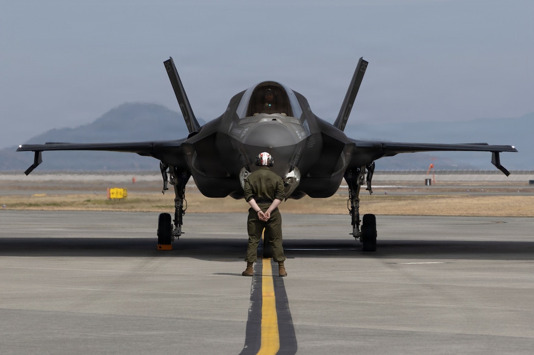 U.S. Marines with Marine Fighter Attack Squadron (VMFA) 242, Marine Aircraft Group 12, 1st Marine Aircraft Wing, performs a pre-flight inspection on an F-35B Lightning II aircraft at Marine Corps Air Station Iwakuni, Yamaguchi Japan, March 24, 2026.