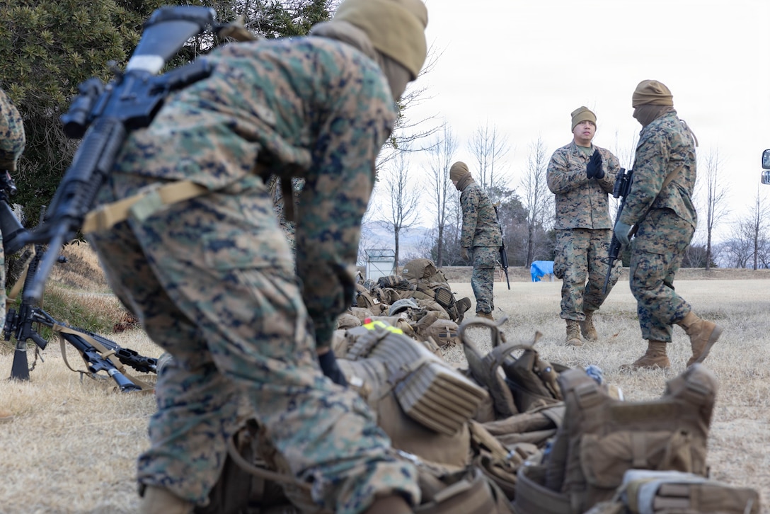 U.S. Marines with Combat Logistics Company 36, Combat Logistics Regiment 35, 3rd Marine Logistics Group; Marine Aviation Logistics Squadron (MALS) 12, Marine Aircraft Group 12, 1st Marine Aircraft Wing; and Headquarters and Headquarters Squadron (HHS), Marine Corps Air Station Iwakuni, unload and organize gear during exercise Northern Dragon 26 at Japan Ground Self-Defense Force Camp Nihonbara, Okayama, Japan, March 13, 2026. CLC-36 holds exercise Northern Dragon yearly to enhance and maintain the unit’s combat logistics capabilities, combat marksmanship proficiency, and medical preparedness in austere terrain and weather conditions. (U.S. Marine Corps photo by Cpl. Colin Thibault)