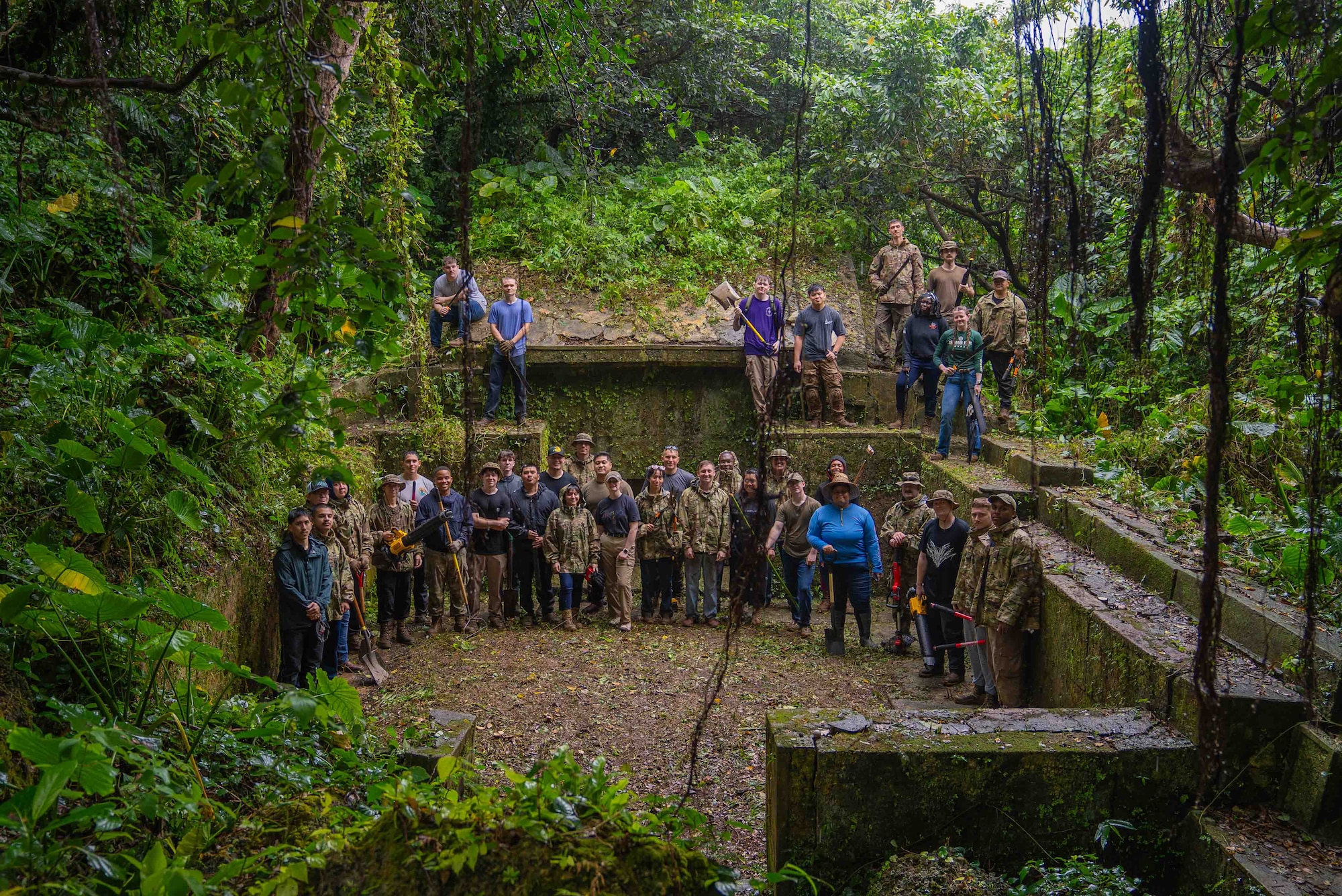 U.S. Air Force Airmen assigned to the 18th Munitions Squadron pose for a group photo after clearing ancestral tombs in preparation for Shimi at Kadena Air Base, Japan, March 25, 2026.