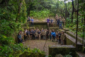 U.S. Air Force Airmen assigned to the 18th Munitions Squadron pose for a group photo after clearing ancestral tombs in preparation for Shimi at Kadena Air Base, Japan, March 25, 2026.