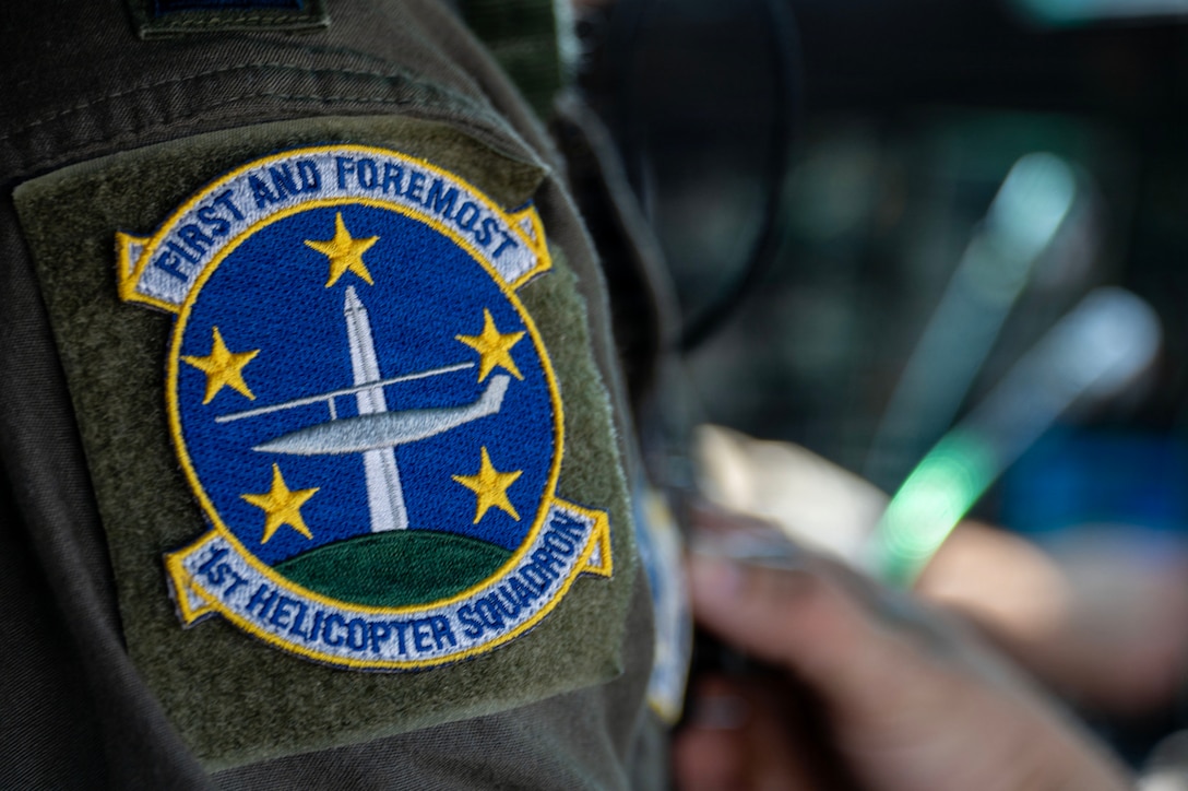 U.S. Air Force 1st Lt. Spenser Schwalm, a mission pilot assigned to the 1st Helicopter Squadron, prepares for a flight at Joint Base Andrews, Maryland, March 26, 2026. The 1st HS conducts rotary-wing airlift, security, and contingency operations in support of Joint Base Andrews and the National Capital Region. (U.S. Air Force photo by Staff Sgt. Aubree Owens)
