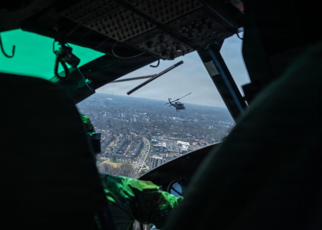 Two UH-1N Hueys, assigned to the 1st Helicopter Squadron, fly in formation toward the Baltimore Orioles’ opening day at Oriole Park at Camden Yards, Maryland, March 26, 2026. The event showcased the planning and teamwork between the 1st HS and game officials to synchronize the flyover during the pregame ceremony. (U.S. Air Force photo by Staff Sgt. Aubree Owens)