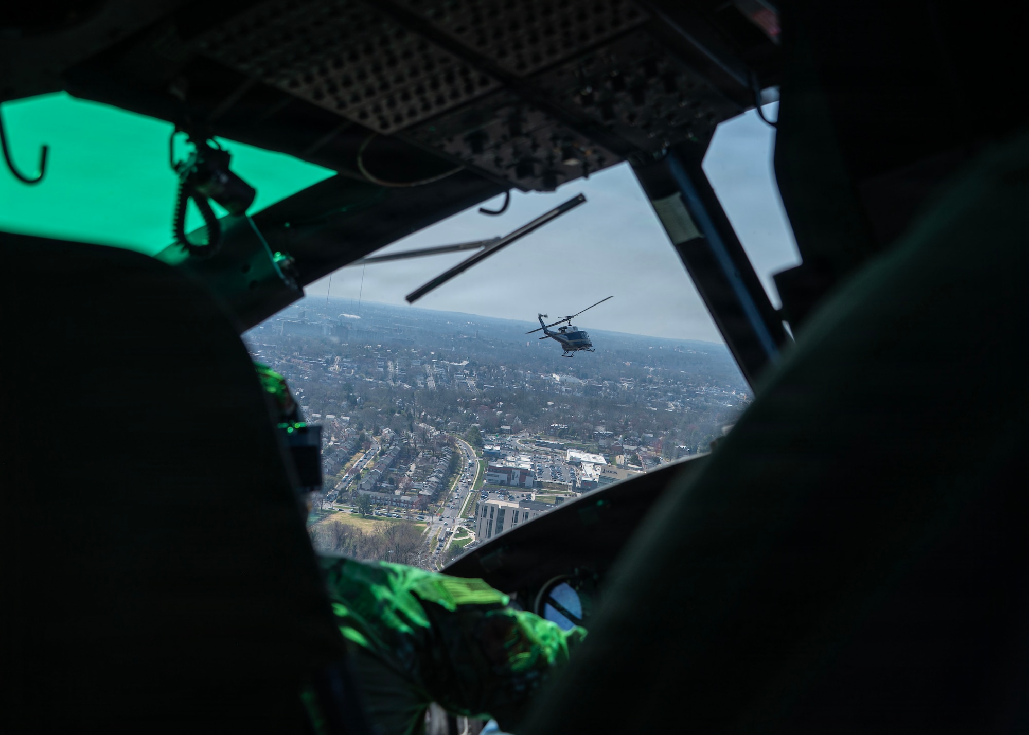 Two UH-1N Hueys, assigned to the 1st Helicopter Squadron, fly in formation toward the Baltimore Orioles’ opening day at Oriole Park at Camden Yards, Maryland, March 26, 2026. The event showcased the planning and teamwork between the 1st HS and game officials to synchronize the flyover during the pregame ceremony. (U.S. Air Force photo by Staff Sgt. Aubree Owens)