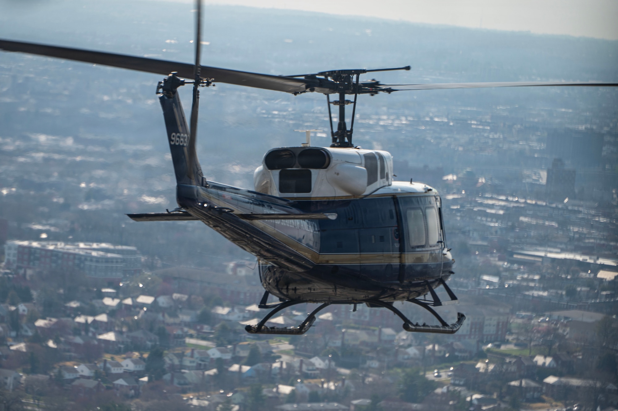 A UH-1N Huey assigned to the 1st Helicopter Squadron flies toward Oriole Park at Camden Yards, Maryland, to conduct a flyover for the Baltimore Orioles opening game, March 26, 2026. Joint Base Andrews supports flyovers for community events to showcase trained aviation, support recruitment, and boost patriotism. (U.S. Air Force photo by Staff Sgt. Aubree Owens)