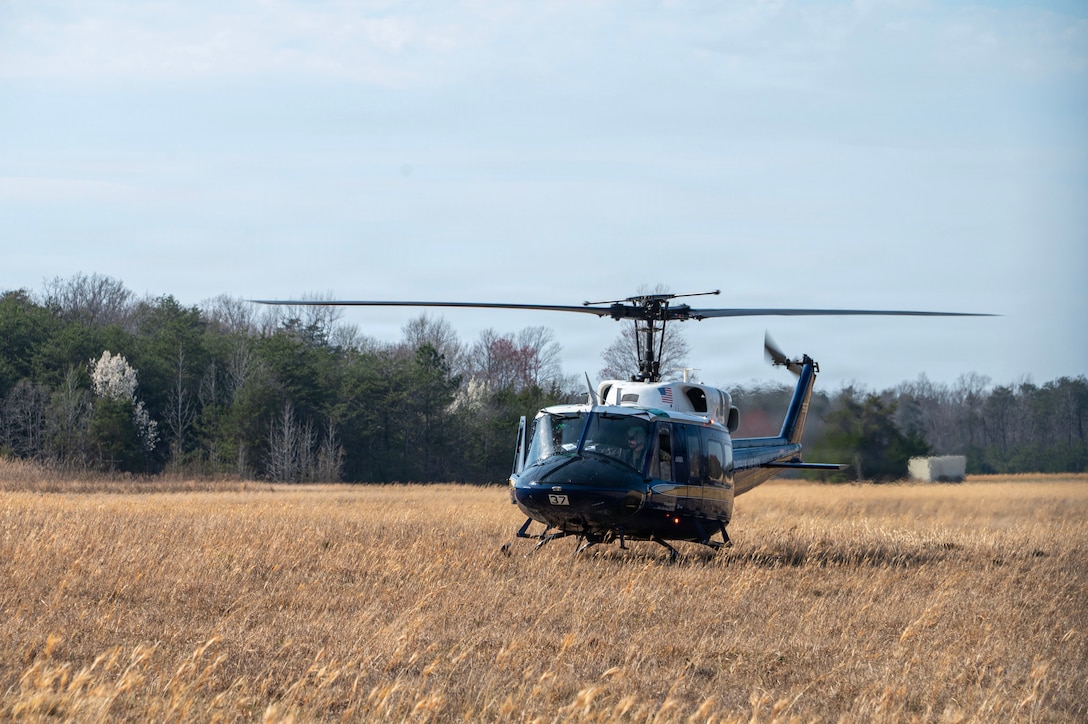 A UH-1N Huey, assigned to the 1st Helicopter Squadron, lands in austere location following a flyover for the Baltimore Orioles opening game, Maryland, March 26, 2026. As part of this training, military aircraft conducted touch-and-go landings to help familiarize aircrew with procedures for contingency operations, emergency preparedness and Defense Support to Civil Authorities mission sets. (U.S. Air Force photo by Staff Sgt. Aubree Owens)