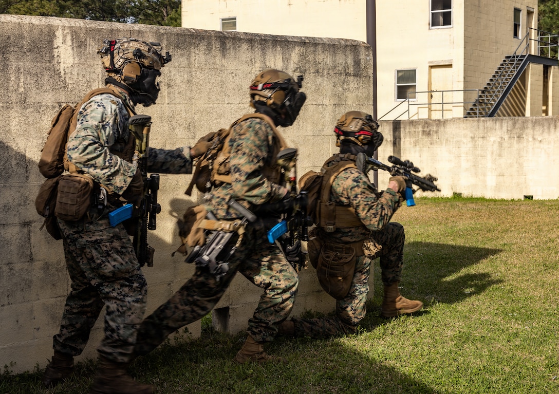 U.S. Marines with 2nd Marine Division participate in a simulated fire and maneuver operation as part of an infantry squad competition on Marine Corps Base Camp Lejeune, North Carolina, March 17, 2026. Marines took part in replicated combat scenarios and live-fire ranges in order to increase readiness and build camaraderie during competition. (U.S. Marine Corps Photos by Lance Cpl. Jaden Beardsley)