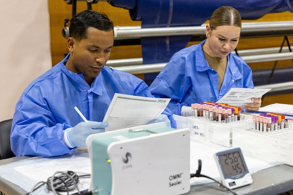 YOKOSUKA, Japan (Feb. 25, 2026) — Laboratory personnel from the Armed Services Blood Bank Center (ASBBC) Okinawa coordinate blood processing operations during a blood drive at Yokosuka’s Fleet Recreation Gym. U.S. Naval Hospital (USNH) Yokosuka, in partnership with ASBBC Okinawa, hosted a two-day blood drive at Commander, Fleet Activities Yokosuka’s Fleet Recreation Gym, Feb. 25–26, collecting 179 units of whole blood in support of operational readiness across the Indo-Pacific region. (U.S. Navy photo by Daniel Taylor/USNMRTC Yokosuka Public Affairs)