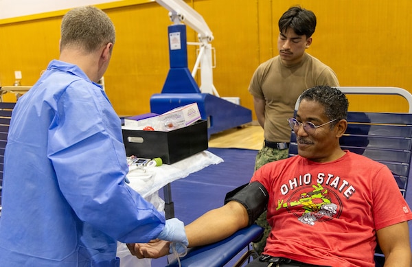 YOKOSUKA, Japan (Feb. 25, 2026) — Laboratory personnel from U.S. Naval Hospital Yokosuka and the Armed Services Blood Bank Center Okinawa prepare a donor for blood collection during a blood drive at Yokosuka’s Fleet Recreation Gym. U.S. Naval Hospital (USNH) Yokosuka, in partnership with the Armed Services Blood Bank Center (ASBBC) Okinawa, hosted a two-day blood drive at Commander, Fleet Activities Yokosuka’s Fleet Recreation Gym, Feb. 25–26, collecting 179 units of whole blood in support of operational readiness across the Indo-Pacific region. (U.S. Navy photo by Daniel Taylor/USNMRTC Yokosuka Public Affairs)