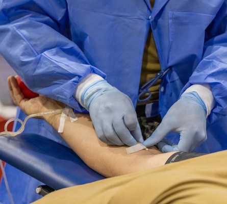 YOKOSUKA, Japan (Feb. 25, 2026) — A laboratory technician starts the blood collection process from Capt. Torrin Velazquez, director U.S. Naval Hospital Yokosuka during a blood drive at Yokosuka’s Fleet Recreation Gym. U.S. Naval Hospital (USNH) Yokosuka, in partnership with the Armed Services Blood Bank Center (ASBBC) Okinawa, hosted a two-day blood drive at Commander, Fleet Activities Yokosuka’s Fleet Recreation Gym, Feb. 25–26, collecting 179 units of whole blood in support of operational readiness across the Indo-Pacific region. (U.S. Navy photo by Daniel Taylor/USNMRTC Yokosuka Public Affairs)
