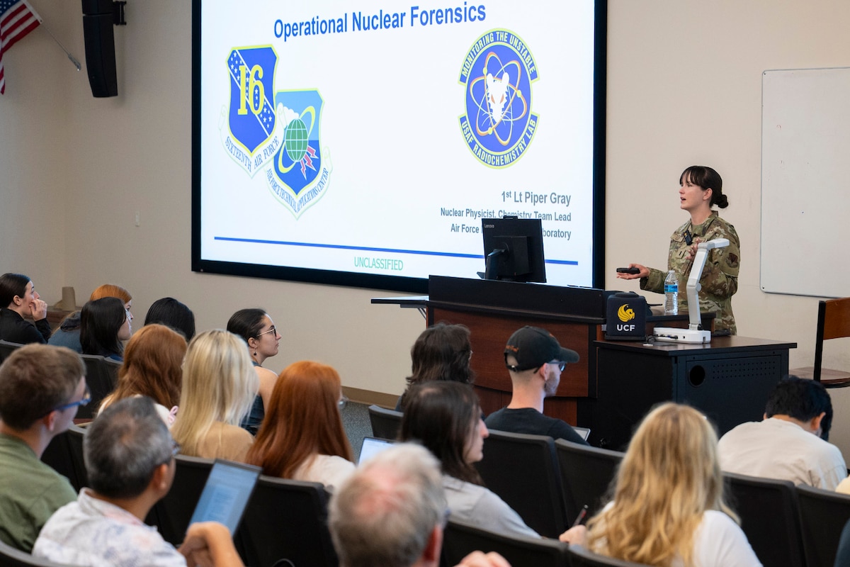 First Lt. Piper Gray, a nuclear physicist and chemistry team lead at the U.S. Air Force Radiochemistry Laboratory headquartered at the Air Force Technical Applications Center, Patrick Space Force Base, Fla., delivers an in-depth presentation to chemistry students studying under Associate Professor Dr. Vasileios Anagnostopoulos, UCF’s Director of Nuclear Regulatory Commission Fellowships, about AFTAC’s role in global nuclear forensics and radiochemistry lab practices in the role of nuclear treaty monitoring.  The visit was in support of the Educational Partnership Agreement the two organizations share.  (U.S. Air Force photo by Matthew S. Jurgens)