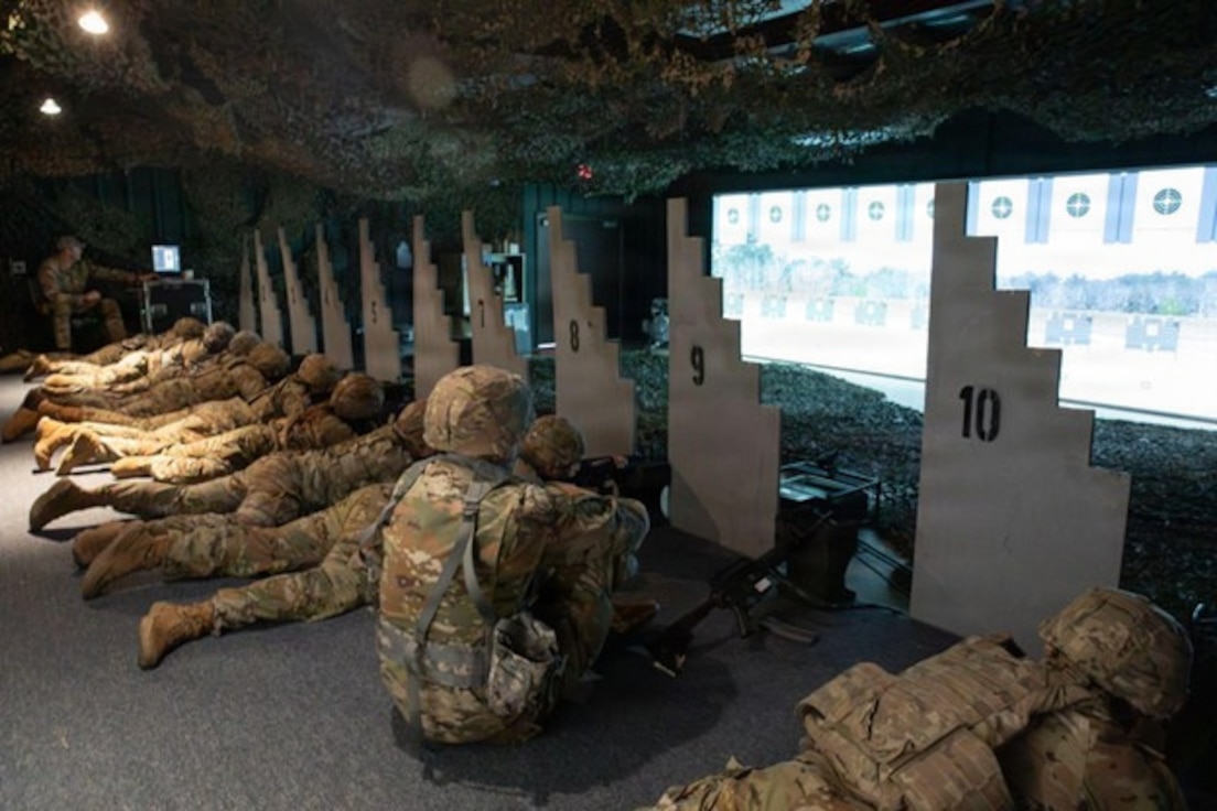 Illinois Army National Guard Soldiers train in the simulated environment of the virtual shooting range in a training building at the Army National Guard training center in Marseilles, Illinois March 23, 2026.