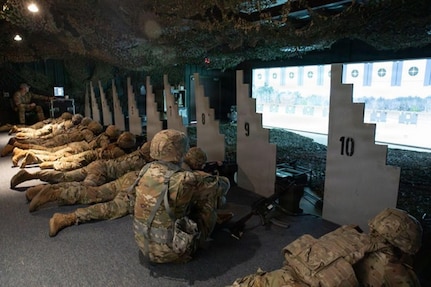 Illinois Army National Guard Soldiers train in the simulated environment of the virtual shooting range in a training building at the Army National Guard training center in Marseilles, Illinois March 23, 2026.