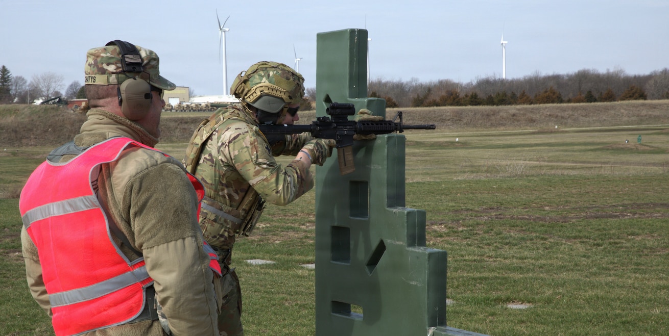 Illinois Army National Guard Soldier Cpl. Steven Castaneda of the Company C, 341st Military Intelligence Battalion, 65th Troop Command, fires at targets at a qualification range at the Army National Guard training center in Marseilles, Illinois March 25, 2026.