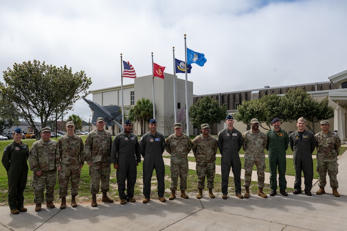 ACC command team pose with 350th Spectrum Warfare Wing command teams during an immersion at the 350th SWW, March 10, 2026.