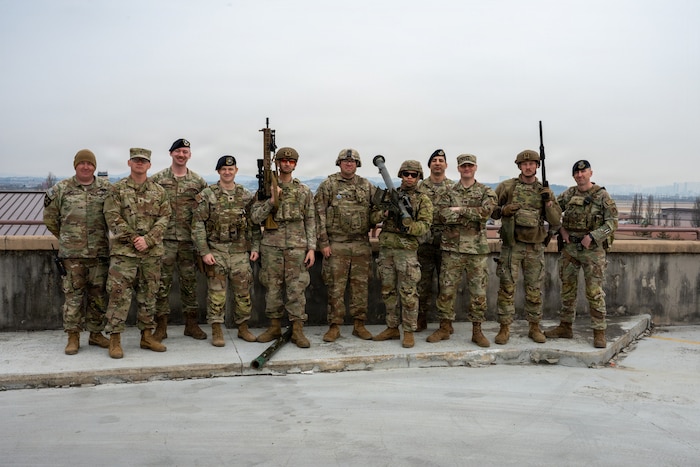 U.S. Army Soldiers assigned to the 35th Air Defense Artillery Brigade and U.S. Air Force Airmen assigned to the 51st Security Forces Squadron pose for a group photo after a joint training scenario as part of Freedom Shield 26 at Osan Air Base, Republic of Korea, March 11, 2026. Joint exercises like this strengthen coordination between U.S. Army and Air Force units and improve readiness against evolving threats. (U.S. Air Force photo by Staff Sgt. Tylir Meyer)