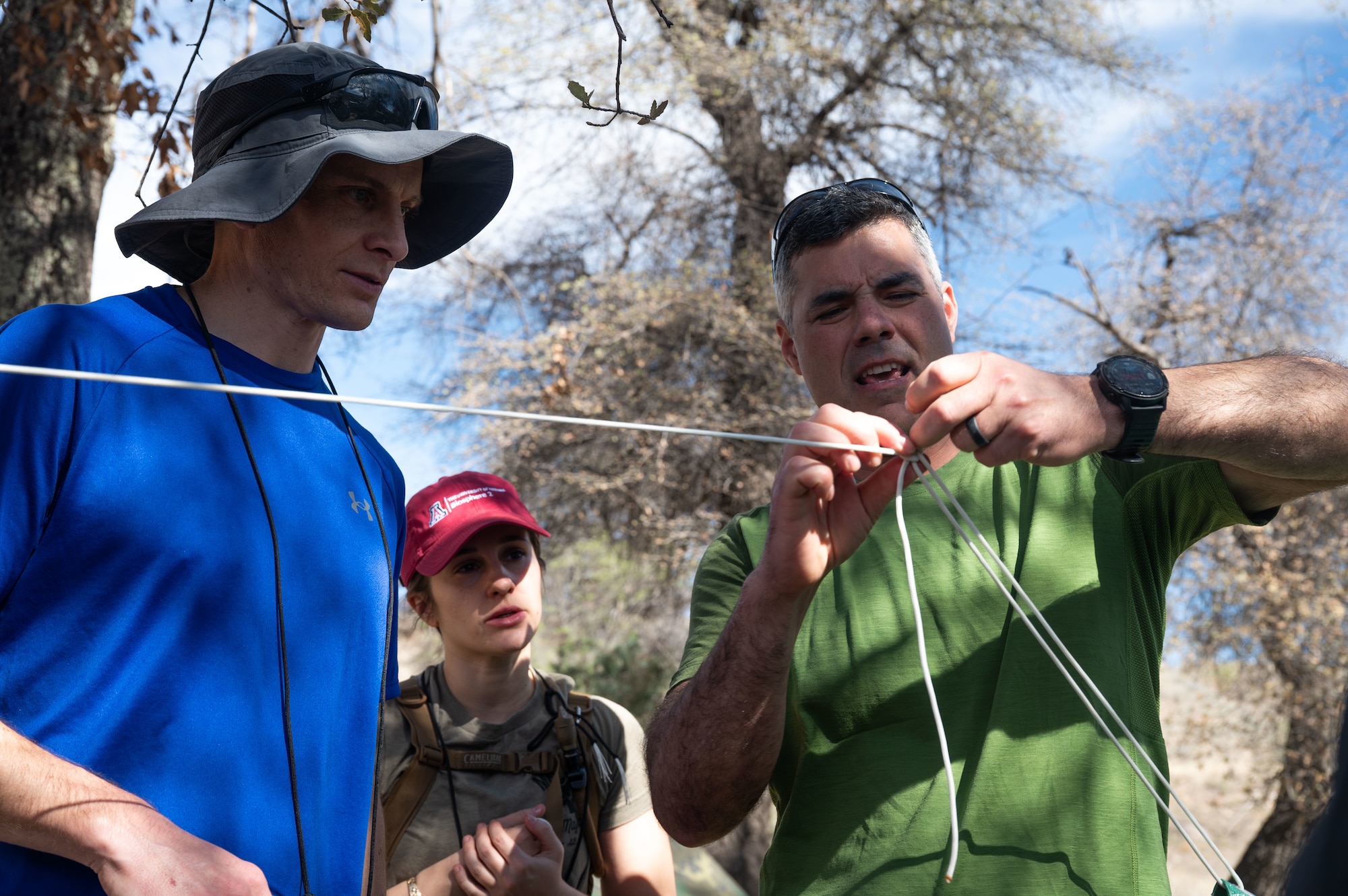 U.S. Air Force Col. Jose Cabrera, 355th Wing commander, participates in a knot tying course during an offsite at Gardner Canyon, Arizona, March 23, 2026. The offsite gave leadership teams an opportunity to step away from their normal workspaces, align priorities and strengthen morale throughout the wing. (U.S. Air Force photo by Airman 1st Class Jaden Kidd)