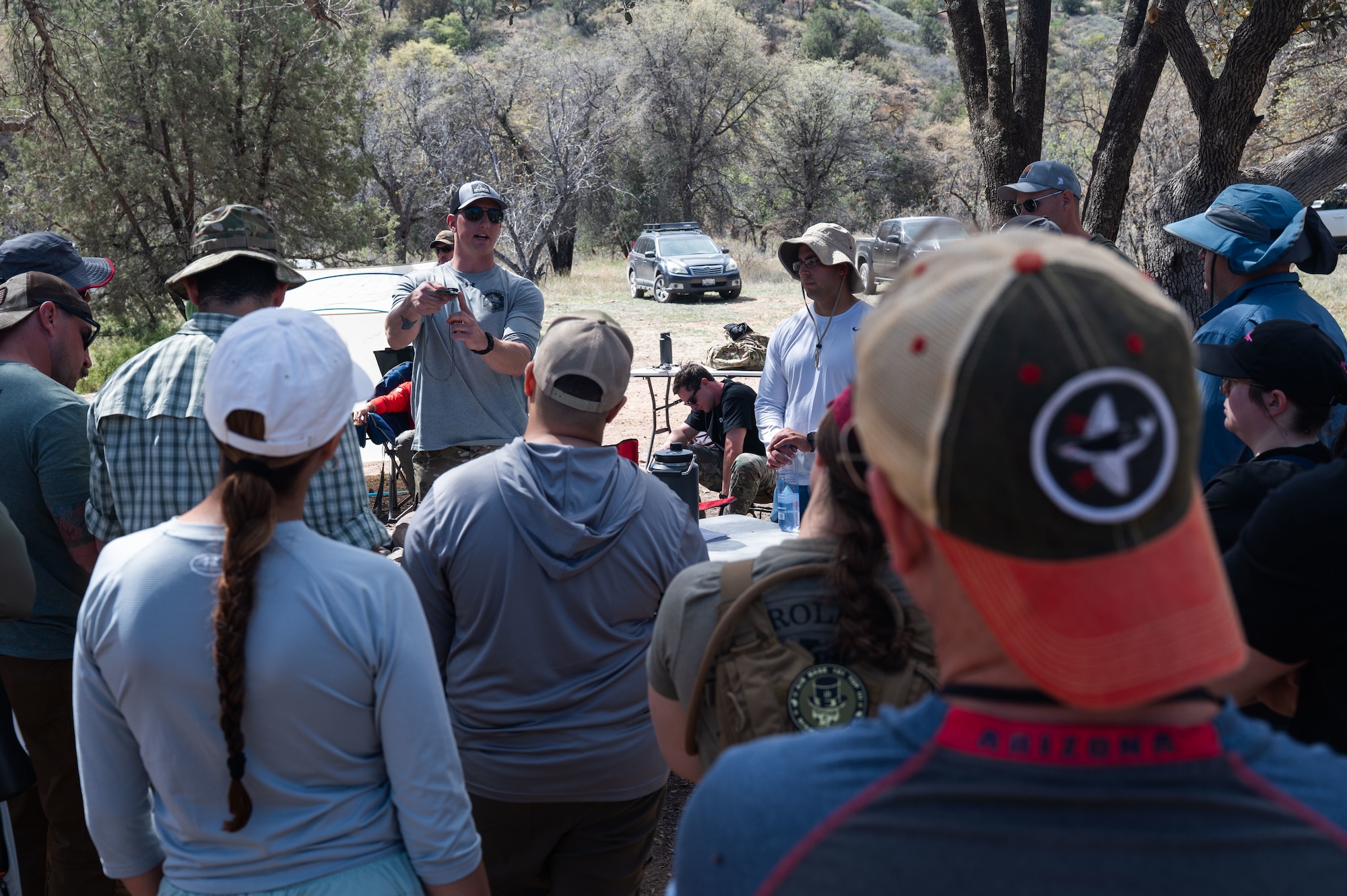 U.S. Air Force Staff Sgt. Joseph Harrington, 563rd Operational Support Squadron survival, evasion, resistance, and escape specialist, teaches a course on land navigation during an offsite at Gardner Canyon, Arizona, March 23, 2026. Leadership from the 355th Wing gathered for an offsite focused on strengthening relationships, building morale and preparing for future challenges. (U.S. Air Force photo by Airman 1st Class Jaden Kidd)