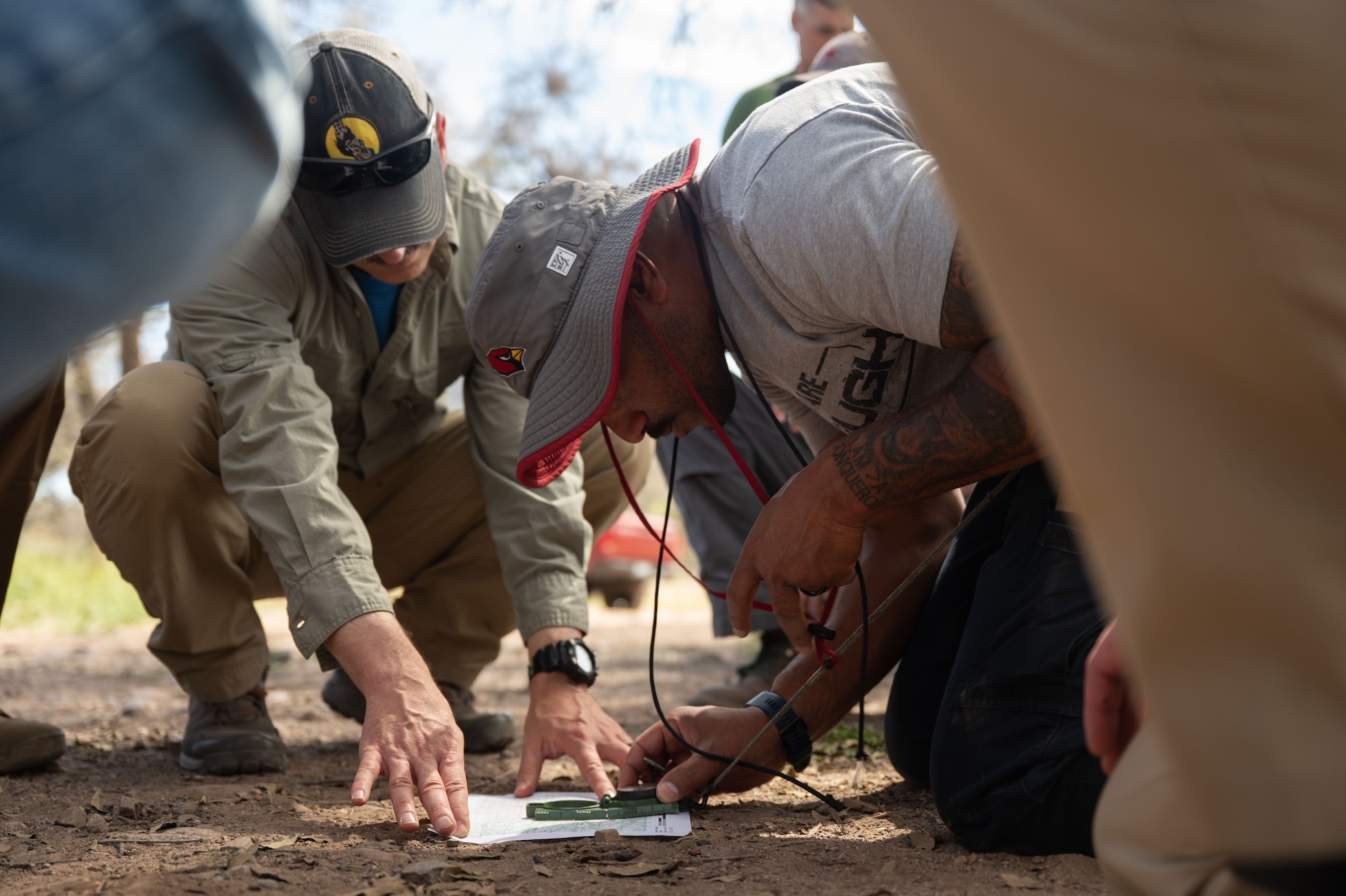 U.S. Air Force Chief Master Sgt. Kelvin Hatcher, 355th Wing command chief, participates in a land navigation course during an offsite at Gardner Canyon, Arizona, March 23, 2026. Participants camped at the location overnight, giving them more time after the courses to sit down and discuss different professional development topics. (U.S. Air Force photo by Airman 1st Class Jaden Kidd)