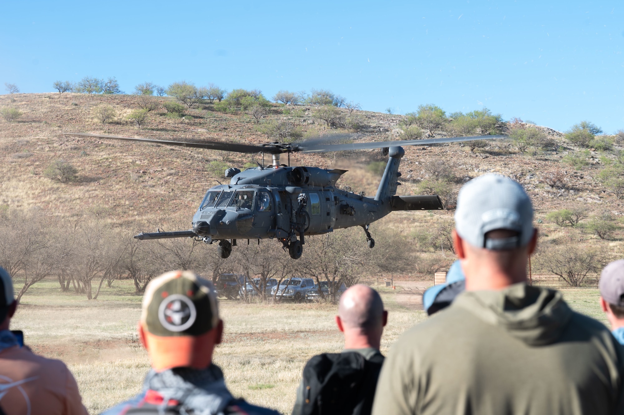U.S. Air Force Col. Chuck Redmond, 355th Wing deputy commander, takes off in an HH-60W Jolly Green II helicopter after participating in an offsite at Gardner Canyon, Arizona, March 23, 2026. The offsite allowed leadership teams to step away from daily operations, align priorities and strengthen morale across the wing. (U.S. Air Force photo by Airman 1st Class Jaden Kidd)