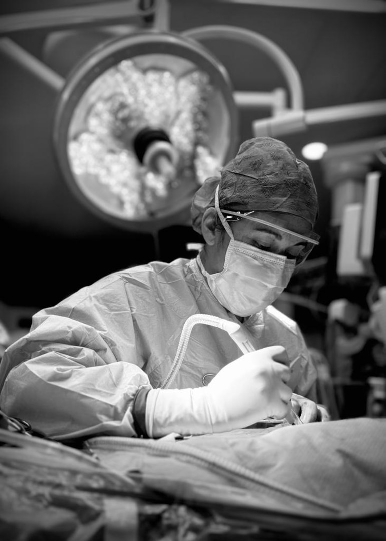Capt. Jenifer Edmondson, an attending general surgeon at Carl R. Darnall Army Medical Center, performs surgery while providing care focused on both precision and compassion. Edmondson emphasizes building trust with patients and keeping families informed throughout the surgical process.