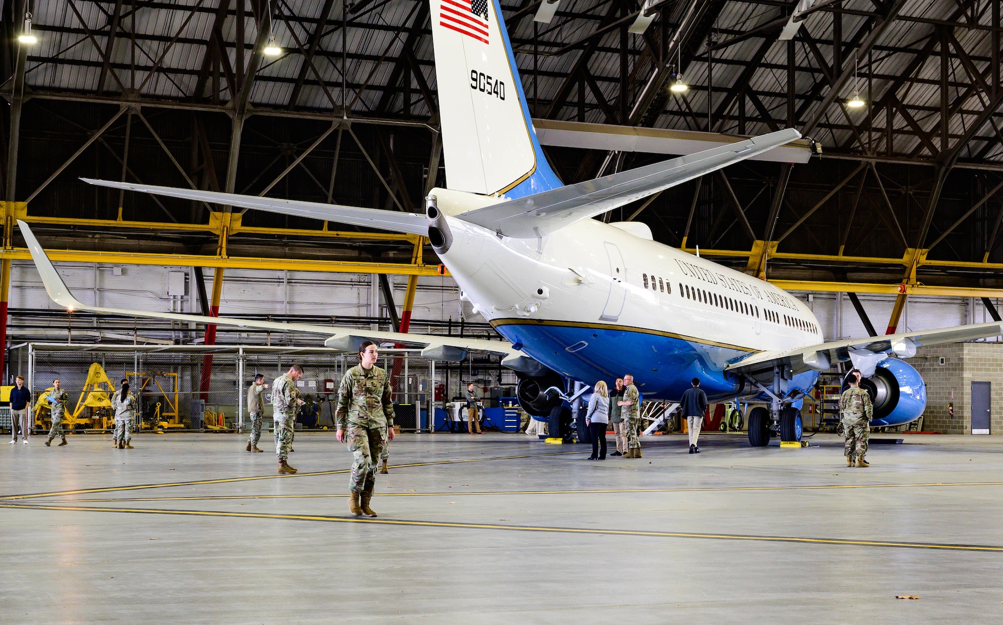 Cadets and service members walk alongside aircraft.