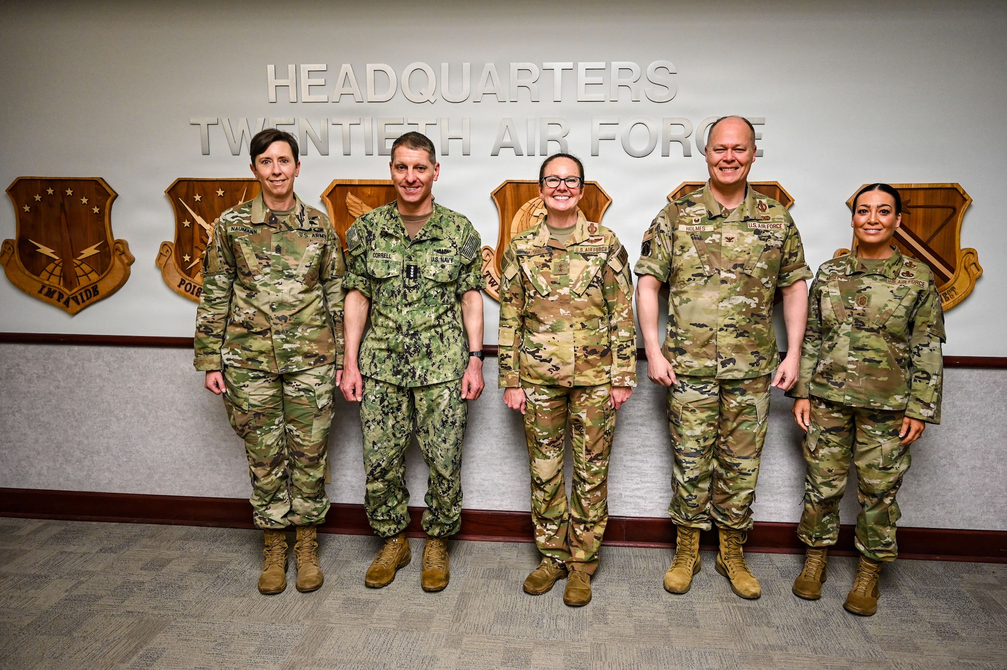 U.S. Navy Adm. Rich Correll (second to left), commander, USSTRATCOM, and U.S. Army Command Sgt. Maj. Jo Naumann (left), USSTRATCOM’s command senior enlisted leader, visited the base and observed firsthand how 90 MW Airmen execute continuous alert operations in support of USSTRATCOM’s global deterrence mission. (U.S. Air Force photo by Senior Airman Mattison Cole)