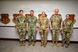U.S. Navy Adm. Rich Correll (second to left), commander, USSTRATCOM, and U.S. Army Command Sgt. Maj. Jo Naumann (left), USSTRATCOM’s command senior enlisted leader, visited the base and observed firsthand how 90 MW Airmen execute continuous alert operations in support of USSTRATCOM’s global deterrence mission. (U.S. Air Force photo by Senior Airman Mattison Cole)