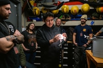 Kevin Marquez Diaz, a contract Materials Engineer, instructs personnel from Puget Sound Naval Shipyard & Intermediate Maintenance Facility (PSNS & IMF) as they participate in Insertable Stalk Inspection System (ISIS360) training prior to a main ballast tank inspection aboard USS Jimmy Carter (SSN 23), January 2026. ISIS360 is a non-human entry inspection system designed to improve the safety and efficiency of shipboard tank inspections. (U.S. Navy photo)