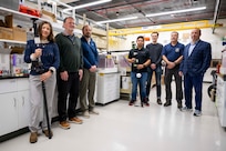 Members of the U.S. Naval Research Laboratory (NRL) team gather for a group photo with their Insertable Stalk Inspection System (ISIS360) in Washington, D.C., on March 3, 2026. The NRL-developed ISIS360 was utilized during inspections of the USS America to improve the safety, speed, and accuracy of the ship's tank inspections. (U.S. Navy photo by Sarah Peterson) RELEASED