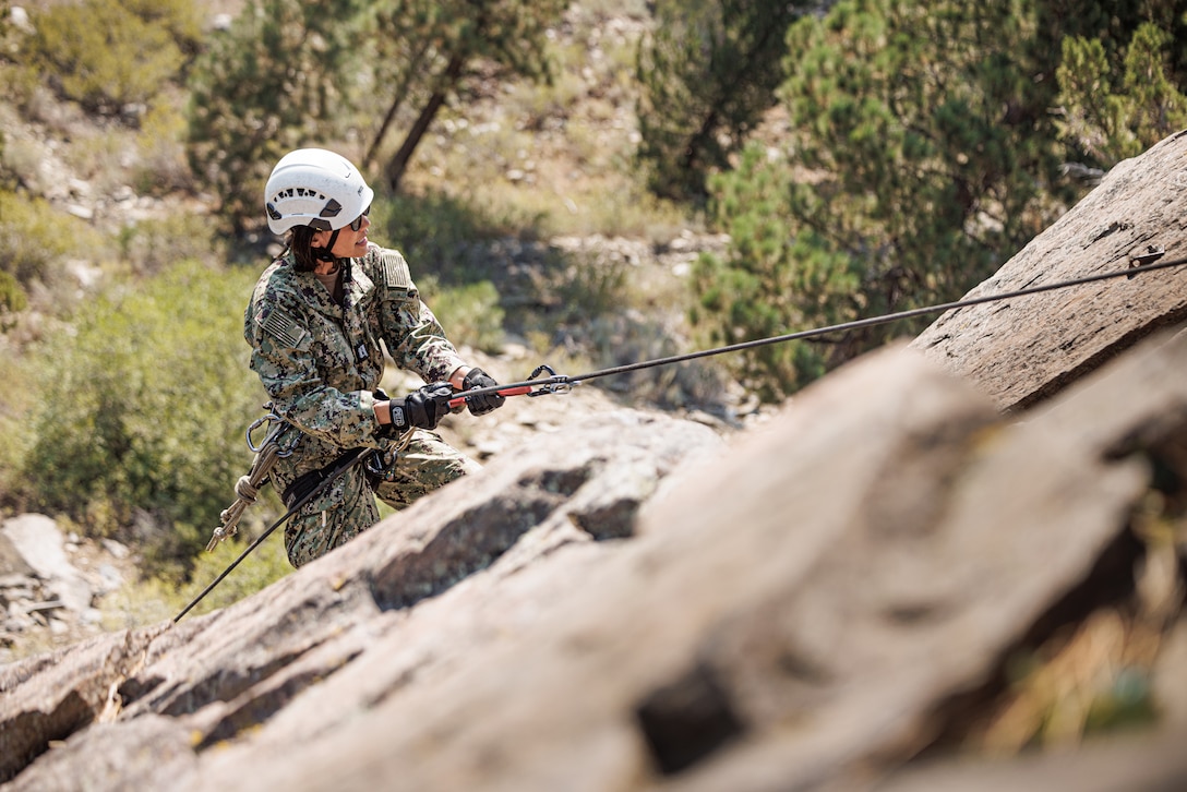 U.S. Navy Lt. Esther Kangas, Maryland native, division officer with Aviation Survival Training Center Cherry Point, Navy Medicine Operational Training Command, Marine Corps Air Station Cherry Point, conducts rappelling techniques during Mountain Medicine 3-25 at Marine Corps Mountain Warfare Training Center, Bridgeport, California, Sep. 5, 2025. MMED challenges service member with various medical and technical problems common to mountainous environments in preparation for future conflicts in austere terrain. (U.S. Marine Corps photo by Lance Cpl. Enge You)