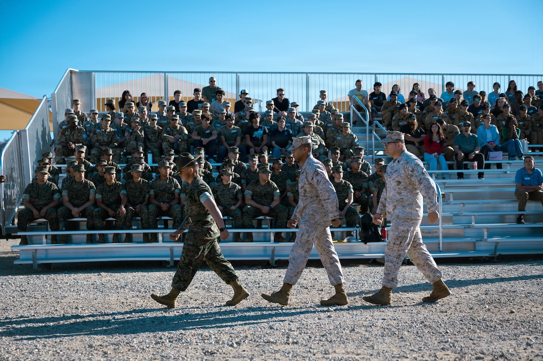 U.S. Marines march in front of students from the Morongo Unified School District at Marine Corps Air Ground Combat Center, Twentynine Palms, California, March 12, 2026. Military career day provided MUSD students a chance to explore possible military career paths and allowed them to speak with recruiters from each military branch. (U.S. Marine Corps photo by Lance Cpl. Gracelyn Hanson)