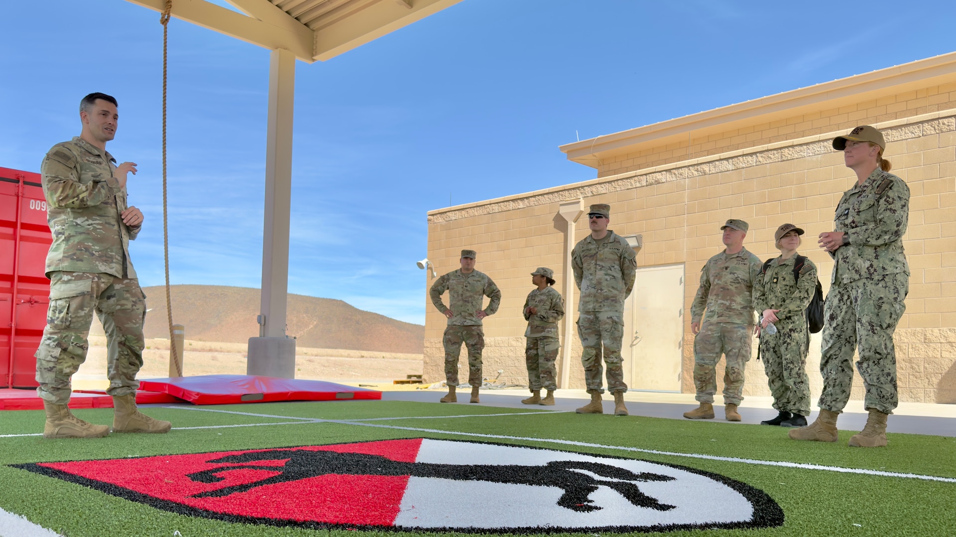 Staff discuss H2F capabilities at Fort Irwin.