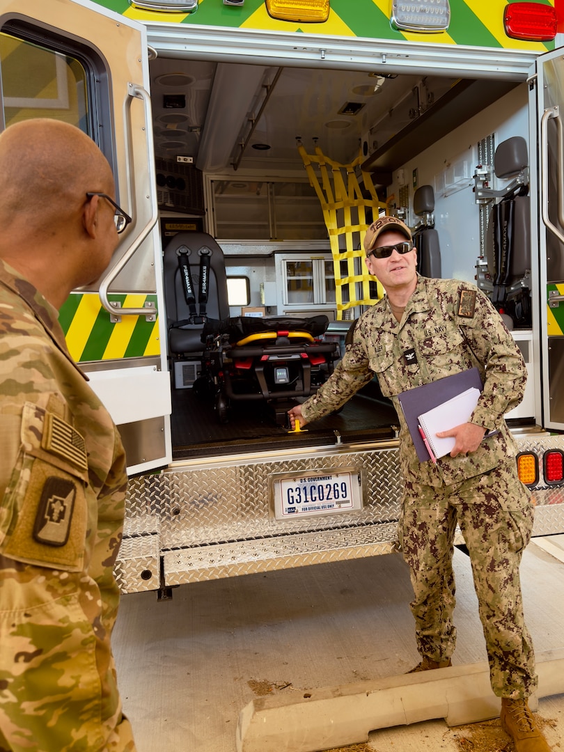 Staff inspect new ambulance.