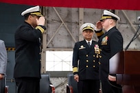 Cmdr. Luis Levine (left) is relieved as the U.S. Naval Research Laboratory Scientific Development Squadron ONE (VXS) 1 commanding officer by Cmdr. Andrew Vawter (right) during a change of command ceremony at Naval Air Station Patuxent River in Patuxent River, Md. March 27, 2026. (U.S. Navy photo by Sarah Peterson)